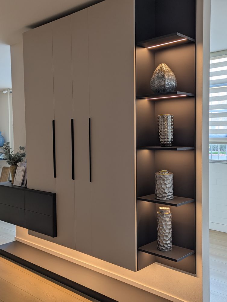 Armonia showroom — grey matte cabinets with LED shelving